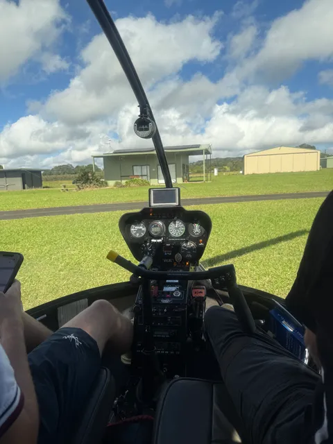 View from inside the cabin over Atherton Aerodrome during a scenic flight.